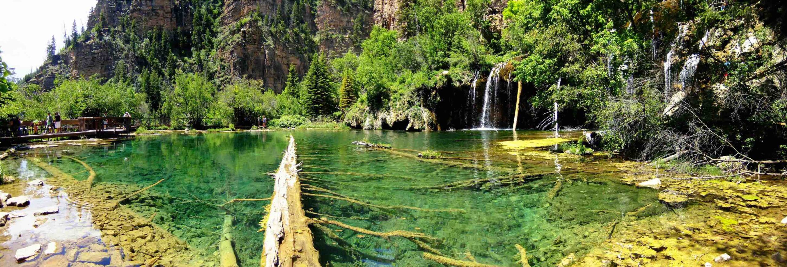 This is a photo of Hanging Lake in Glenwood Canyon. The colors around the lake are extremely vibrant with bright shades of green.